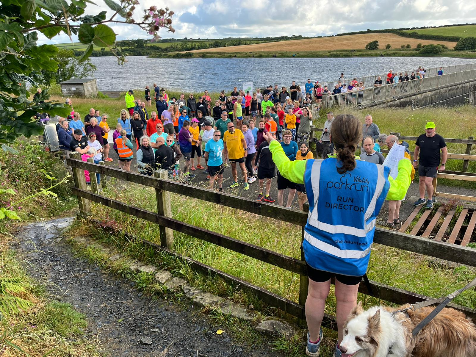 Tamar Lakes parkrun briefing beside the lake before the weekly community 5K